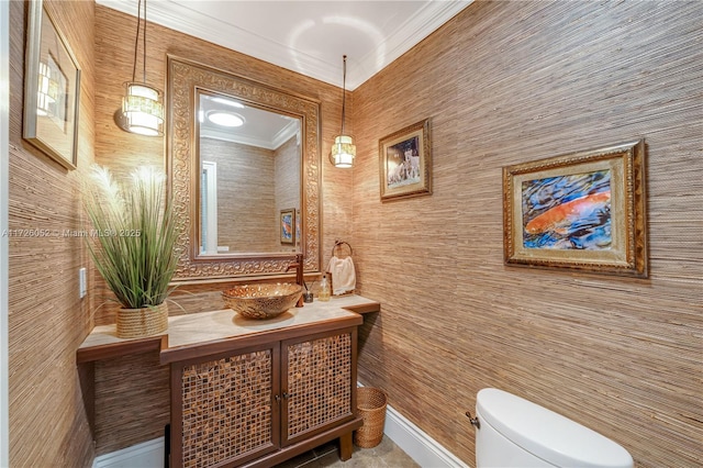 bathroom featuring crown molding, vanity, and toilet