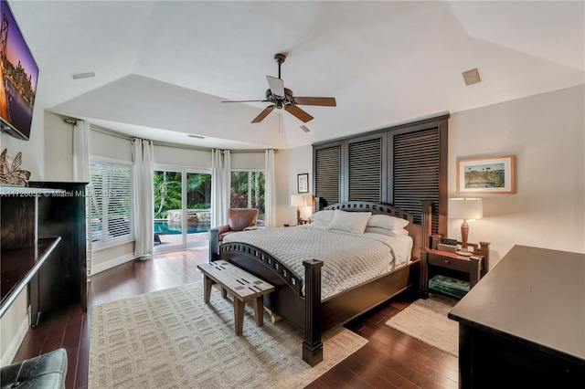 bedroom featuring vaulted ceiling, ceiling fan, access to exterior, and dark hardwood / wood-style floors