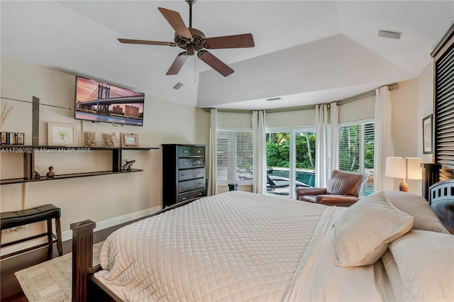 bedroom with ceiling fan, hardwood / wood-style floors, lofted ceiling, and access to exterior