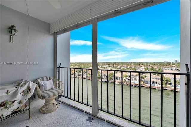 balcony featuring a water view