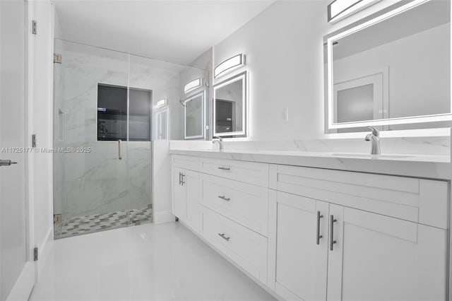 bathroom with an enclosed shower and vanity