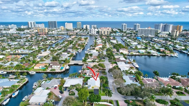 birds eye view of property with a water view