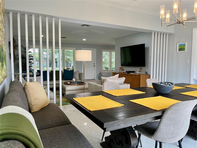 dining space featuring a notable chandelier