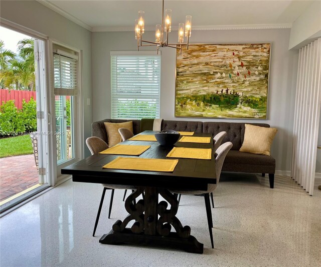 dining area featuring an inviting chandelier and ornamental molding