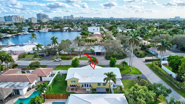 birds eye view of property with a water view