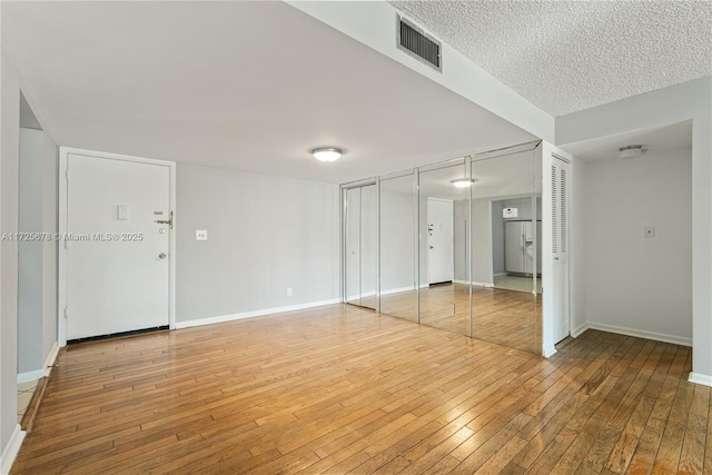 spare room featuring hardwood / wood-style flooring