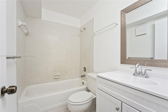 full bathroom featuring toilet, tiled shower / bath combo, and vanity