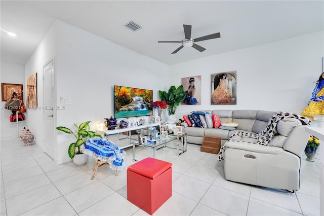 tiled living room featuring ceiling fan