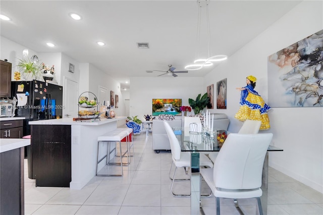 dining area with light tile patterned floors, recessed lighting, visible vents, and ceiling fan