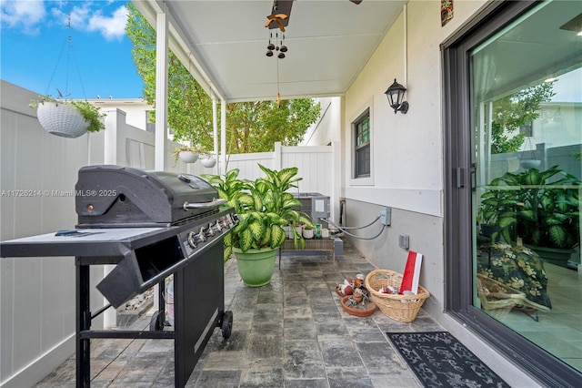 view of patio / terrace featuring area for grilling and fence