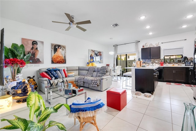 living area with light tile patterned floors, visible vents, a ceiling fan, and recessed lighting