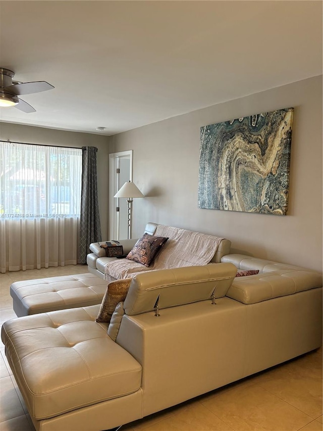 living room with light tile patterned flooring and ceiling fan