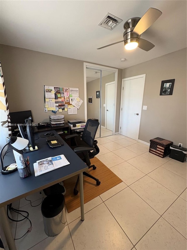 tiled office with ceiling fan