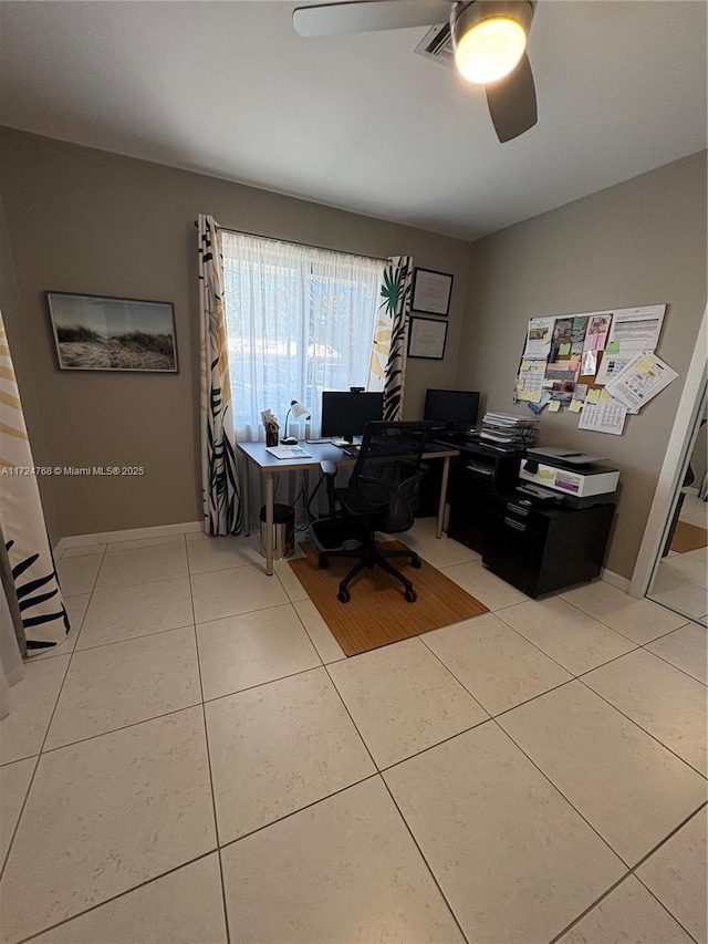 office space with tile patterned floors and ceiling fan