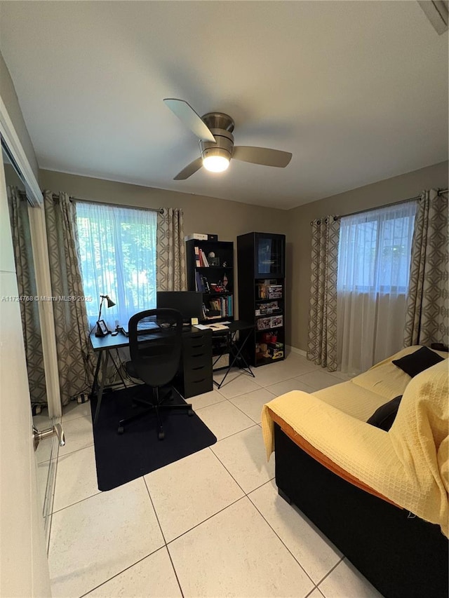 bedroom featuring tile patterned floors and ceiling fan