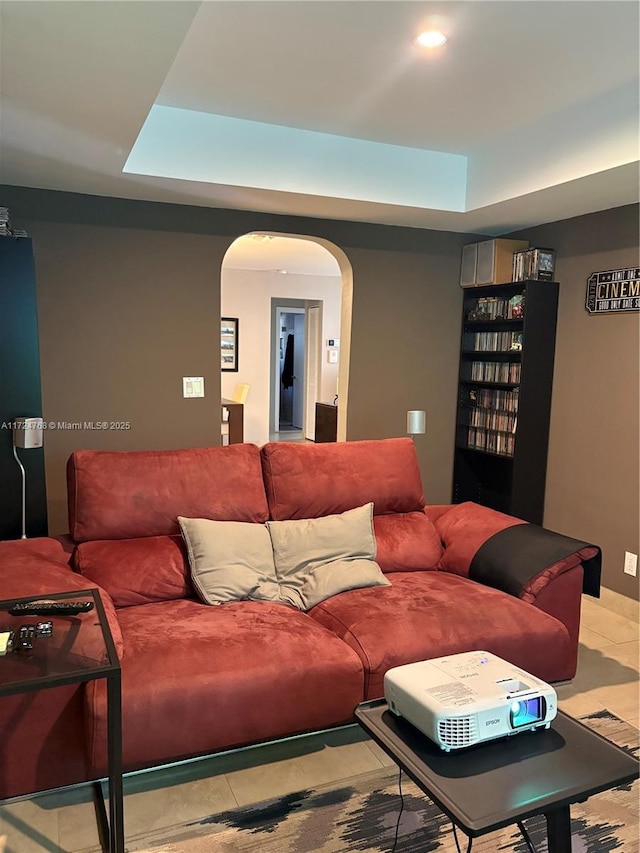 living room featuring a raised ceiling