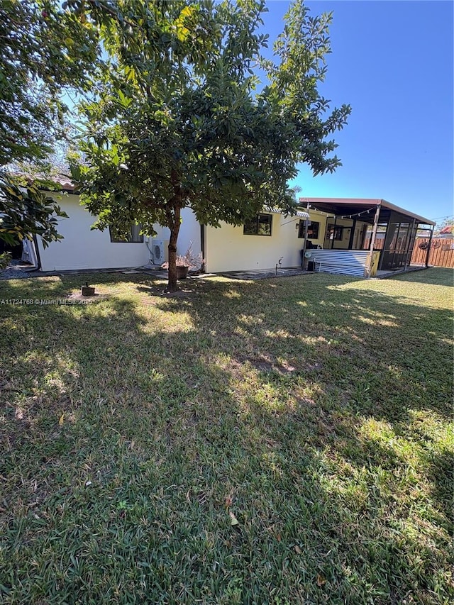 view of yard featuring a sunroom