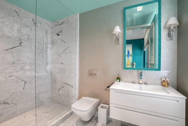 bathroom featuring toilet, a marble finish shower, and vanity