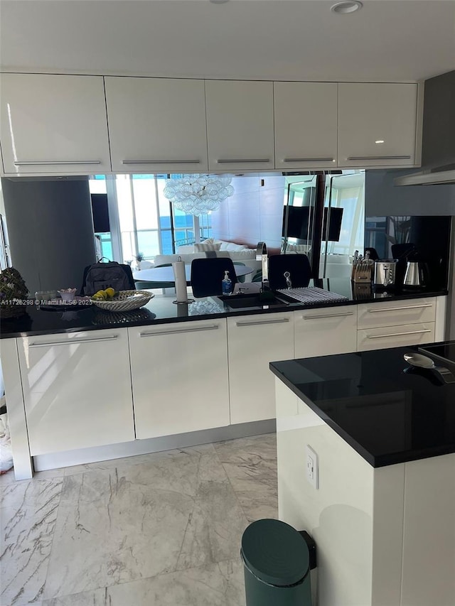 kitchen with white cabinets and white dishwasher