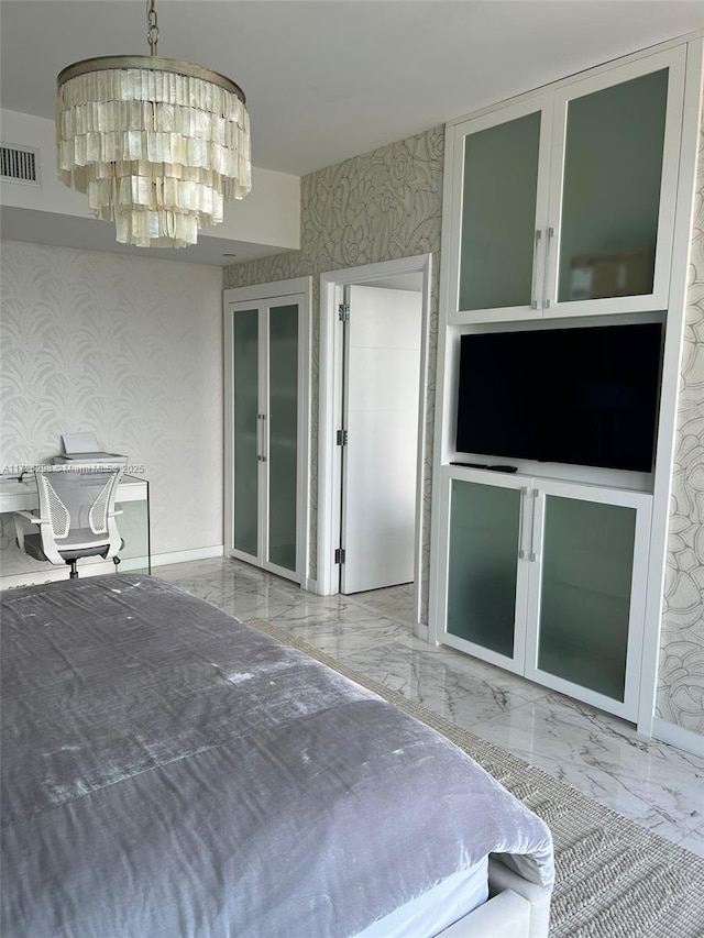 bedroom featuring a chandelier