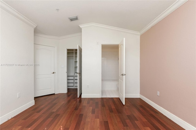 unfurnished bedroom featuring dark wood-type flooring and crown molding