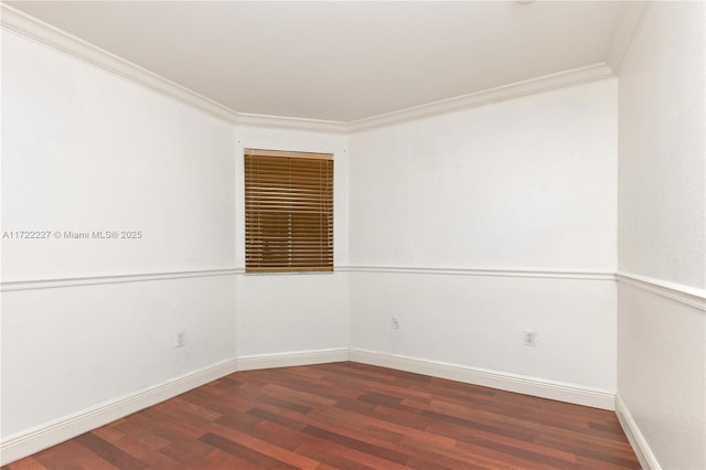 unfurnished room featuring dark hardwood / wood-style flooring and ornamental molding