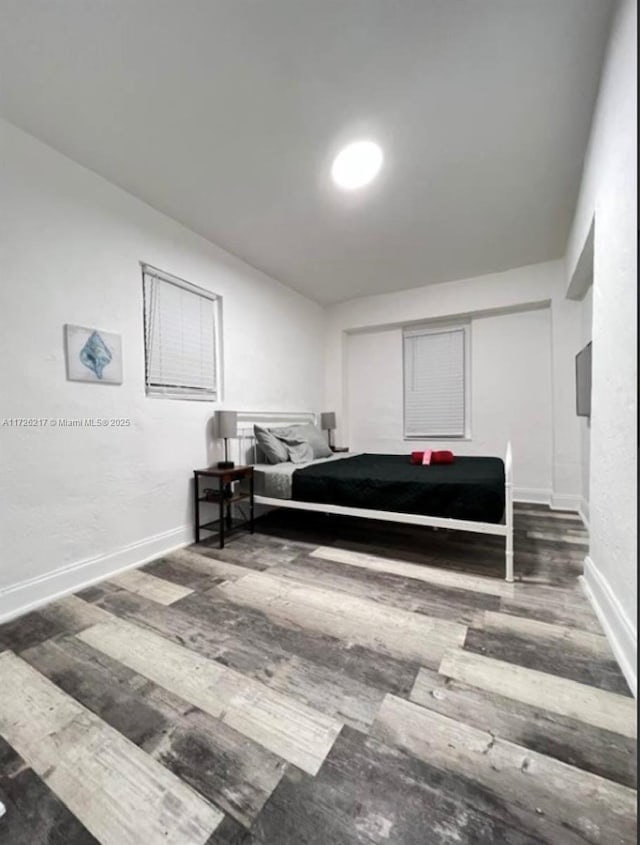 bedroom featuring dark hardwood / wood-style floors