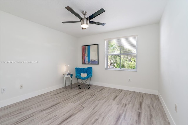 empty room featuring light wood-type flooring and ceiling fan