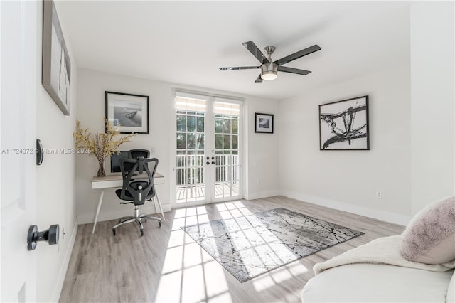 office featuring ceiling fan, french doors, and light hardwood / wood-style flooring