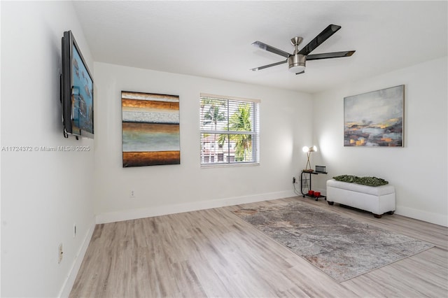 unfurnished room with ceiling fan and light hardwood / wood-style flooring