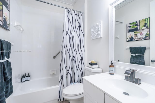 full bathroom with vanity, shower / bath combo with shower curtain, and toilet