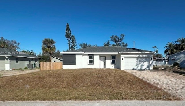 21068 Exmore Ave, Port Charlotte, FL 33952 - ranch-style house featuring central AC and a garage