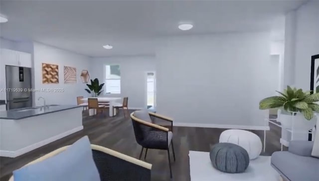 living room featuring dark hardwood / wood-style floors and sink