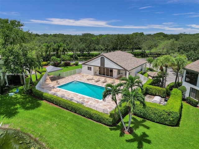 view of pool featuring a patio and a lawn