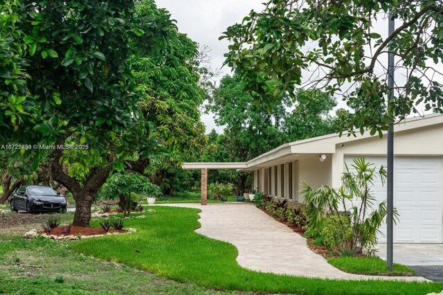 view of yard featuring a garage