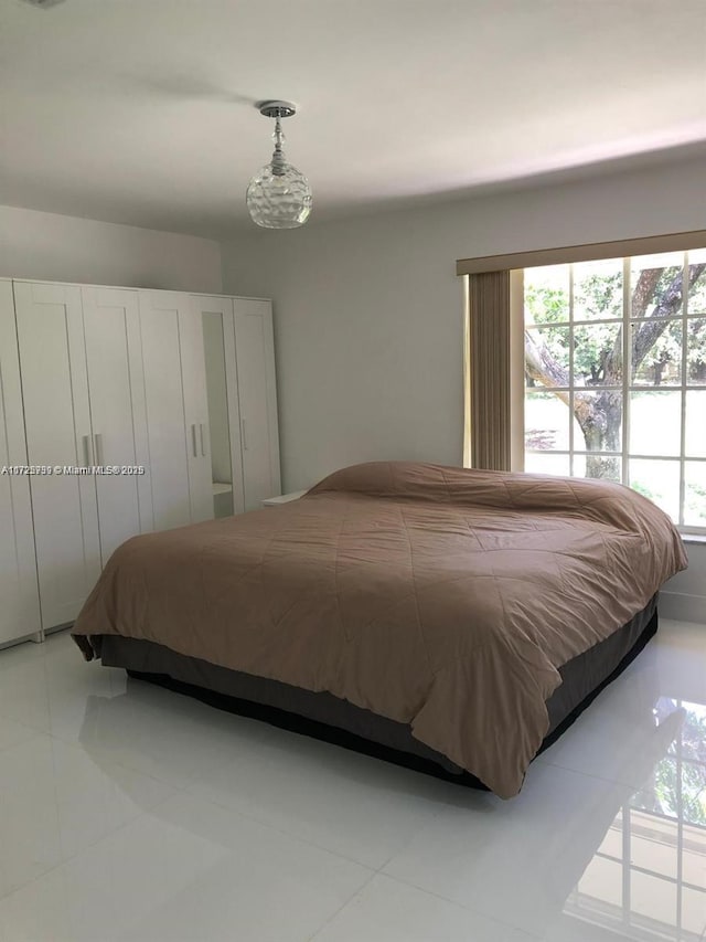 bedroom with light tile patterned floors