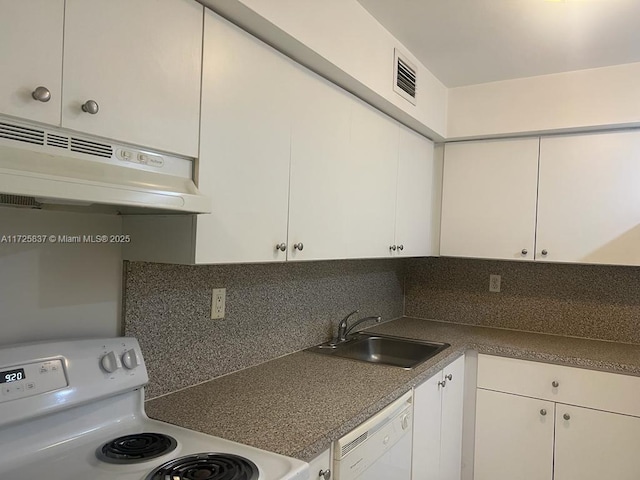 kitchen featuring sink, white appliances, decorative backsplash, and white cabinets