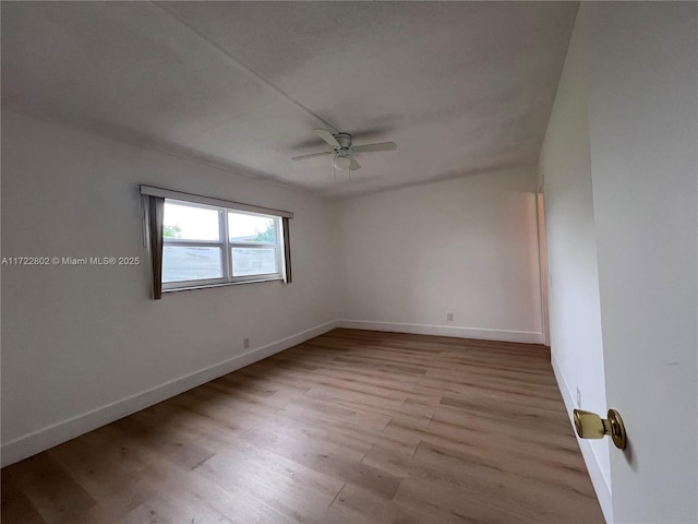 unfurnished room with light wood-type flooring and ceiling fan