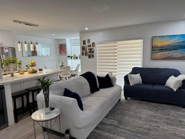 living area featuring recessed lighting and light wood-style floors