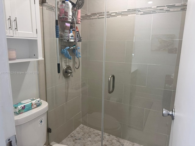 bathroom with toilet and walk in shower