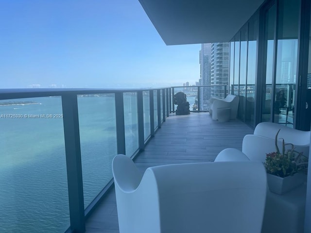 balcony featuring a water view