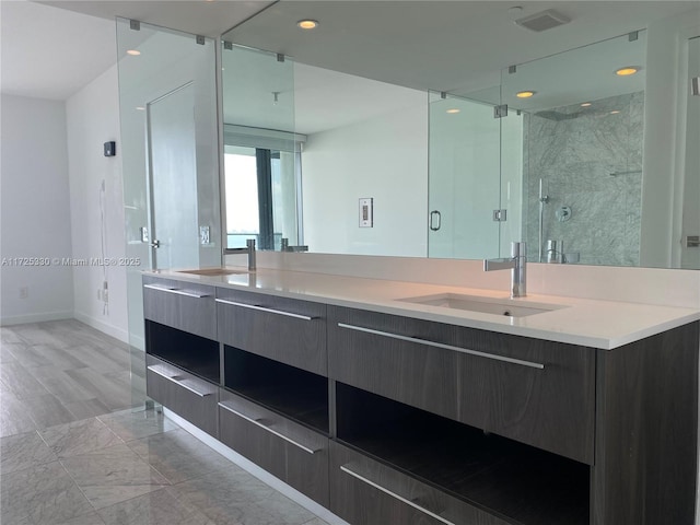 bathroom featuring an enclosed shower and vanity