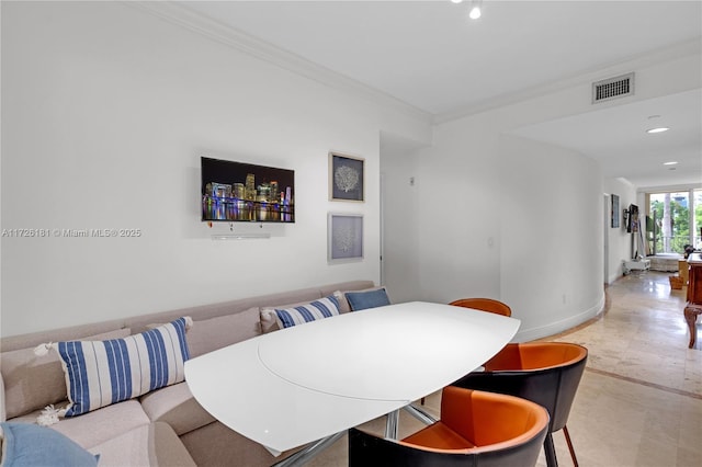 dining space with ornamental molding and light tile patterned floors