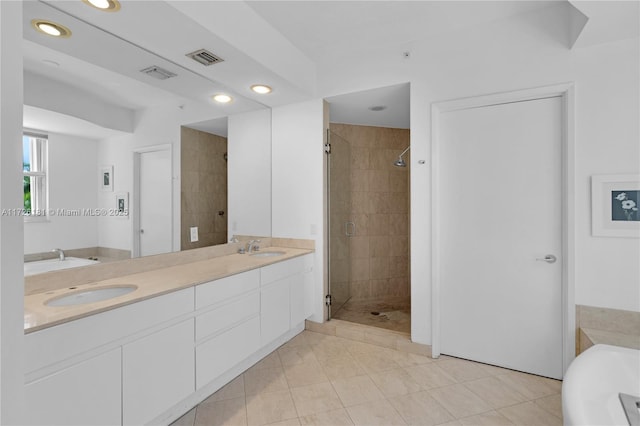 bathroom featuring separate shower and tub, tile patterned flooring, and vanity