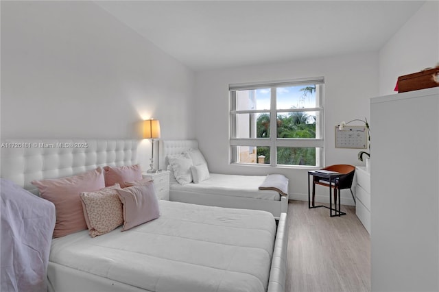 bedroom with light hardwood / wood-style flooring