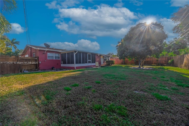 view of yard with a sunroom