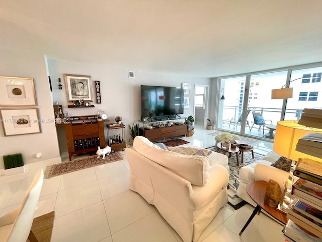 tiled living room featuring expansive windows