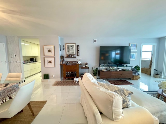 living room featuring light tile patterned flooring