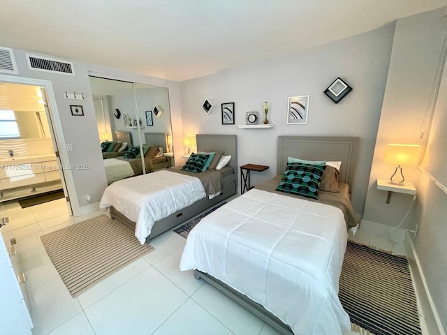 tiled bedroom featuring a closet