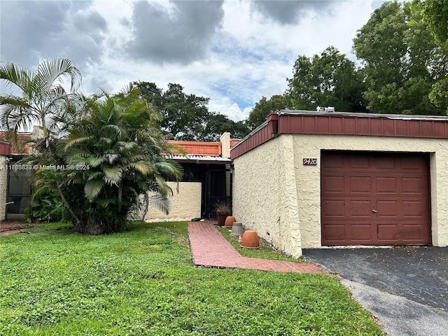 garage featuring a yard